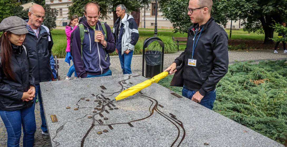 Guided tour group in Wroclaw, Poland, examining a city map.