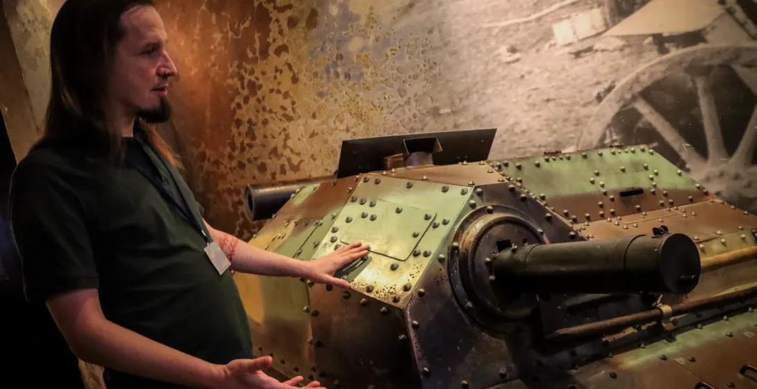 The guide explaining World War Two tankette exhibit inside Schindler's Factory Museum in Krakow, Poland.