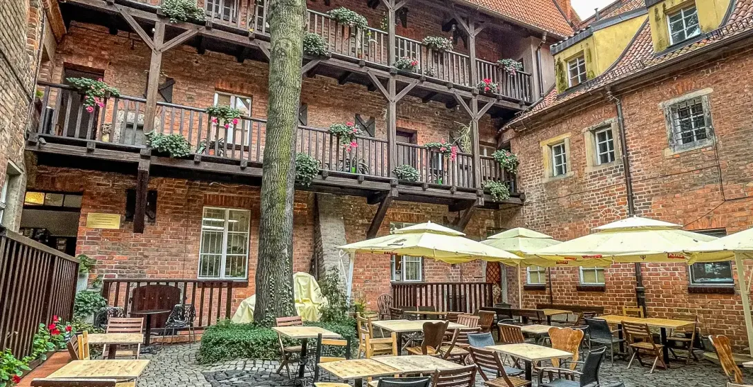 Charming courtyard restaurant in Wrocław, Germany.