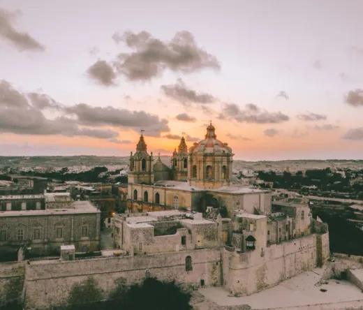 Aerial view of St. Paul's Cathedral in Mdina, Malta at sunset.