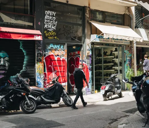 Tourists exploring Athens, Greece, near the Acropolis.
