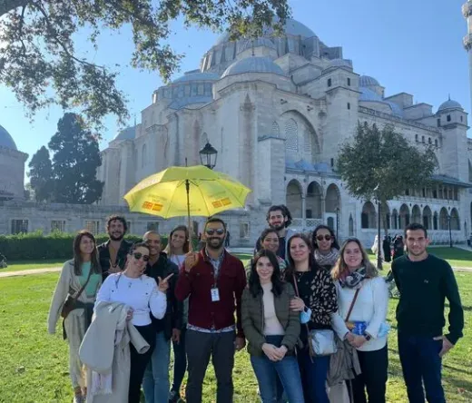 Happy tour group in front of the Süleymaniye Mosque in Istanbul.