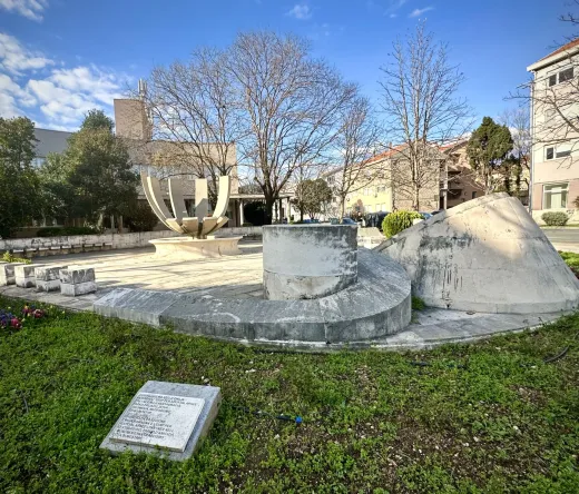 Stone monument in a Mostar park.