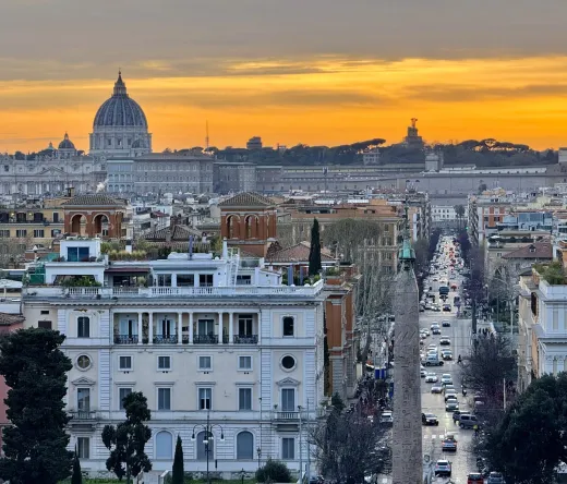 Stunning sunset view of Rome, featuring St. Peter's Basilica.