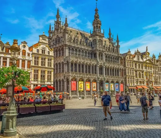 Tourists exploring the magnificent Grand Place in Brussels, Belgium.