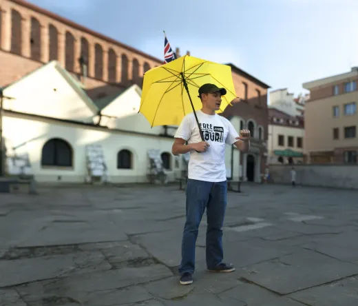 A tour guide in Krakow, Poland, leads a walking tour.