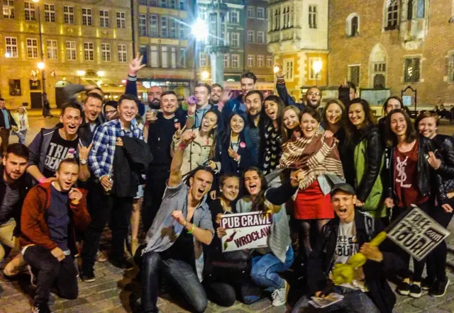 Happy tourists on a Wrocław pub crawl.