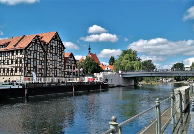 Bydgoszcz cityscape with river and architecture.