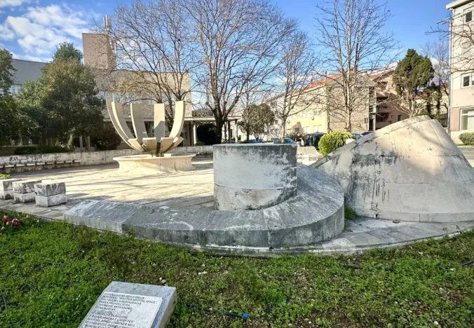 Stone monument in a Mostar park.