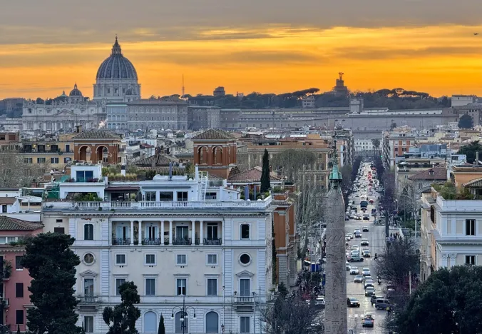 Stunning sunset view of Rome, featuring St. Peter's Basilica.