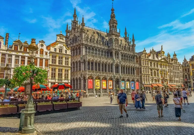 Tourists exploring the magnificent Grand Place in Brussels, Belgium.