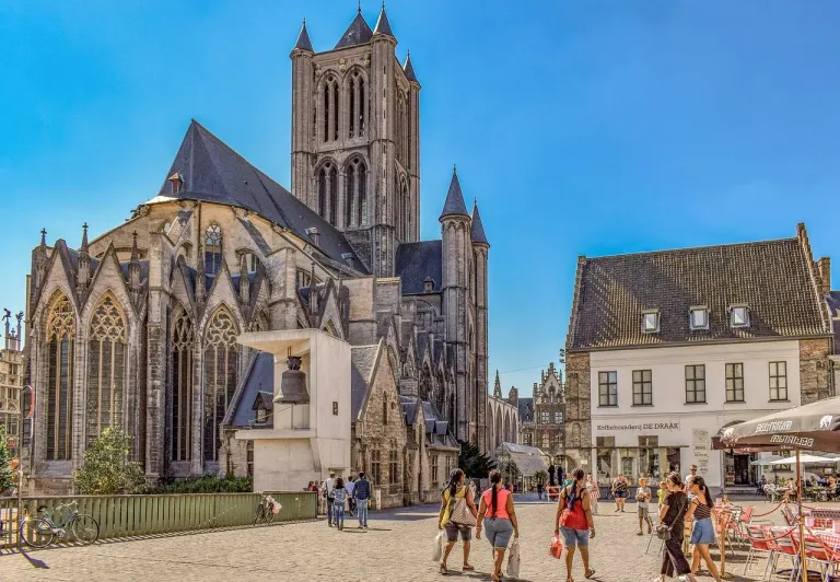 Tourists exploring the historic center of Ghent, Belgium, on a Legends of Ghent Tour.