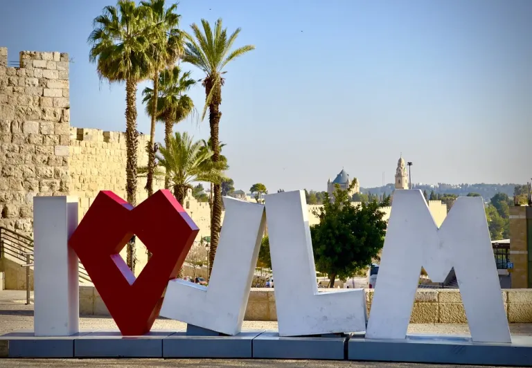 I❤JERUSALEM sign in front of Jerusalem's Old City walls.