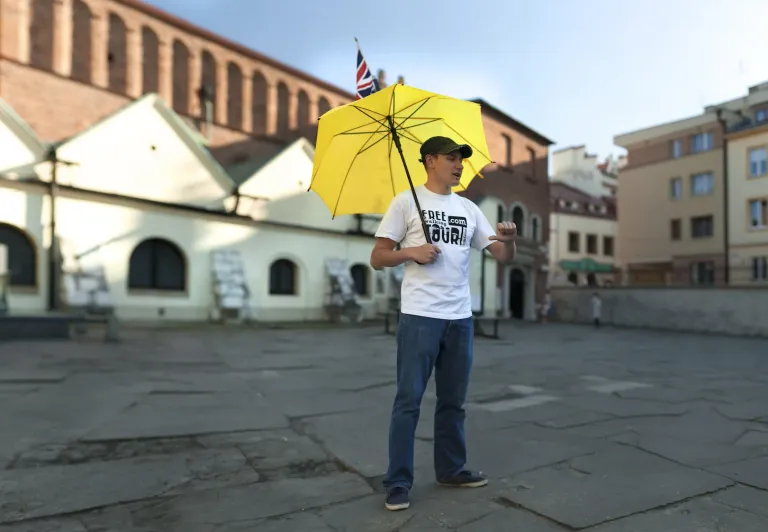 A tour guide in Krakow, Poland, leads a walking tour.