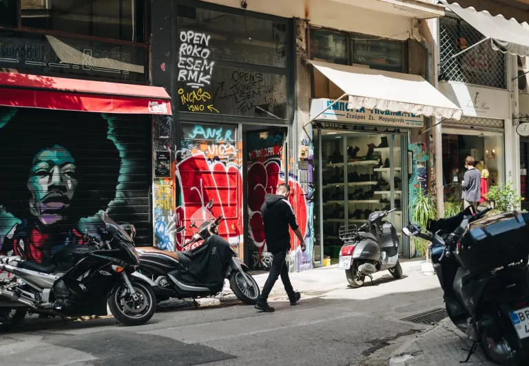 Tourists exploring Athens, Greece, near the Acropolis.