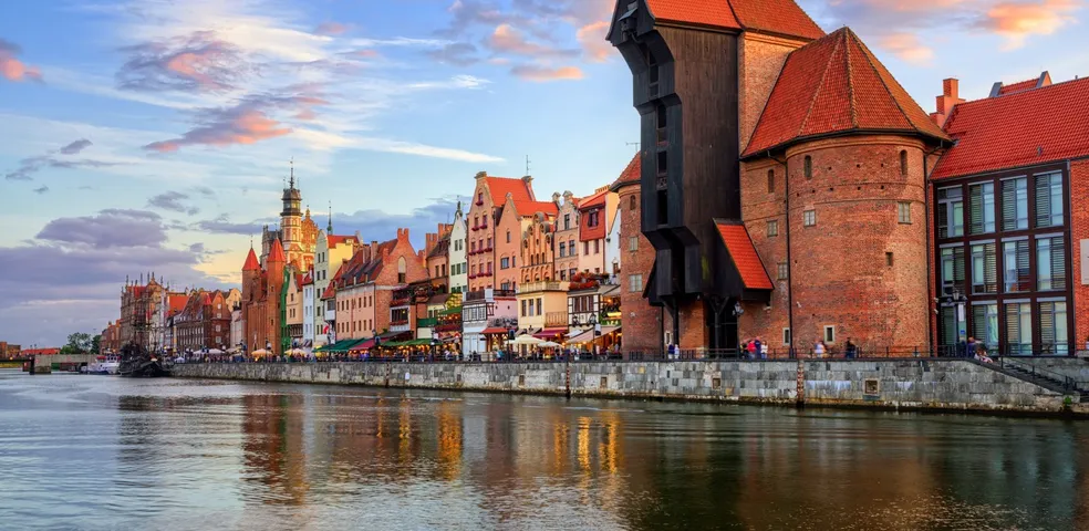 Explore Gdansk's historic waterfront, featuring the iconic Crane and colorful buildings.