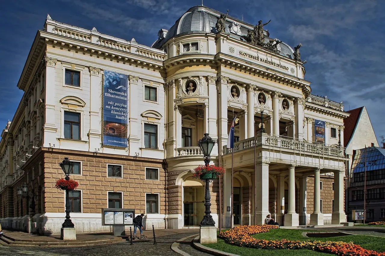 Grand historic building of the Slovak National Theatre in Bratislava, featuring a classical facade with columns, dome, and...