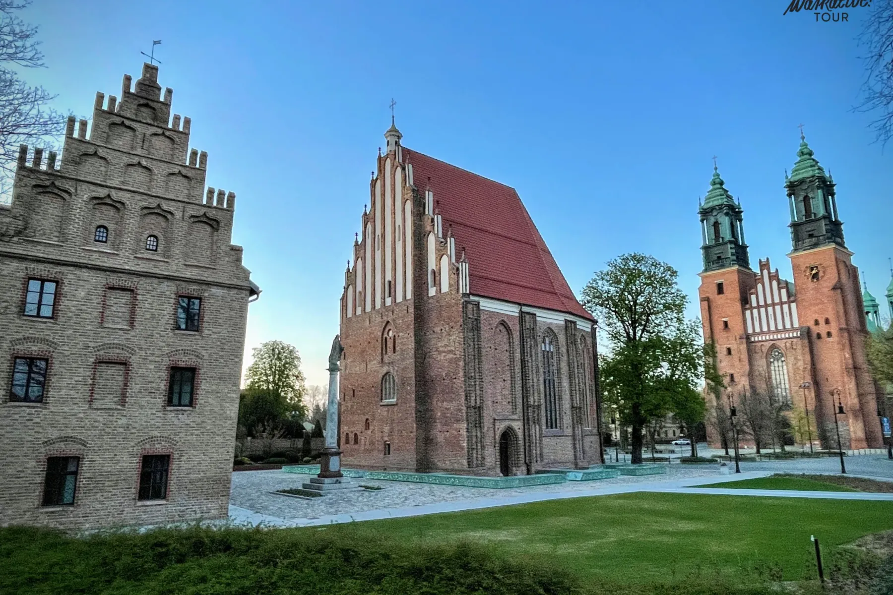 Three historic brick buildings on Ostrów Tumski in Poznań: a stepped-gable house, a church, and the cathedral with green s...