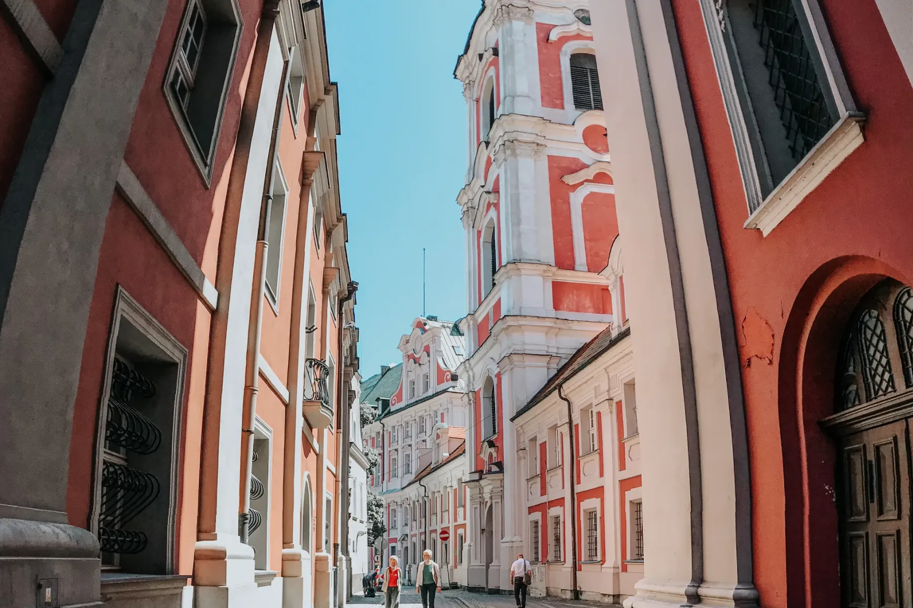 Tourists enjoying a free walking tour in Krakow's Old Town.