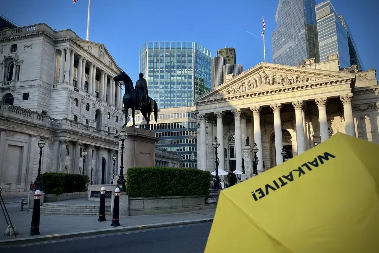 Bank of England building, equestrian statue of Wellington, and Royal Exchange building. Modern skyscrapers are visible beh...