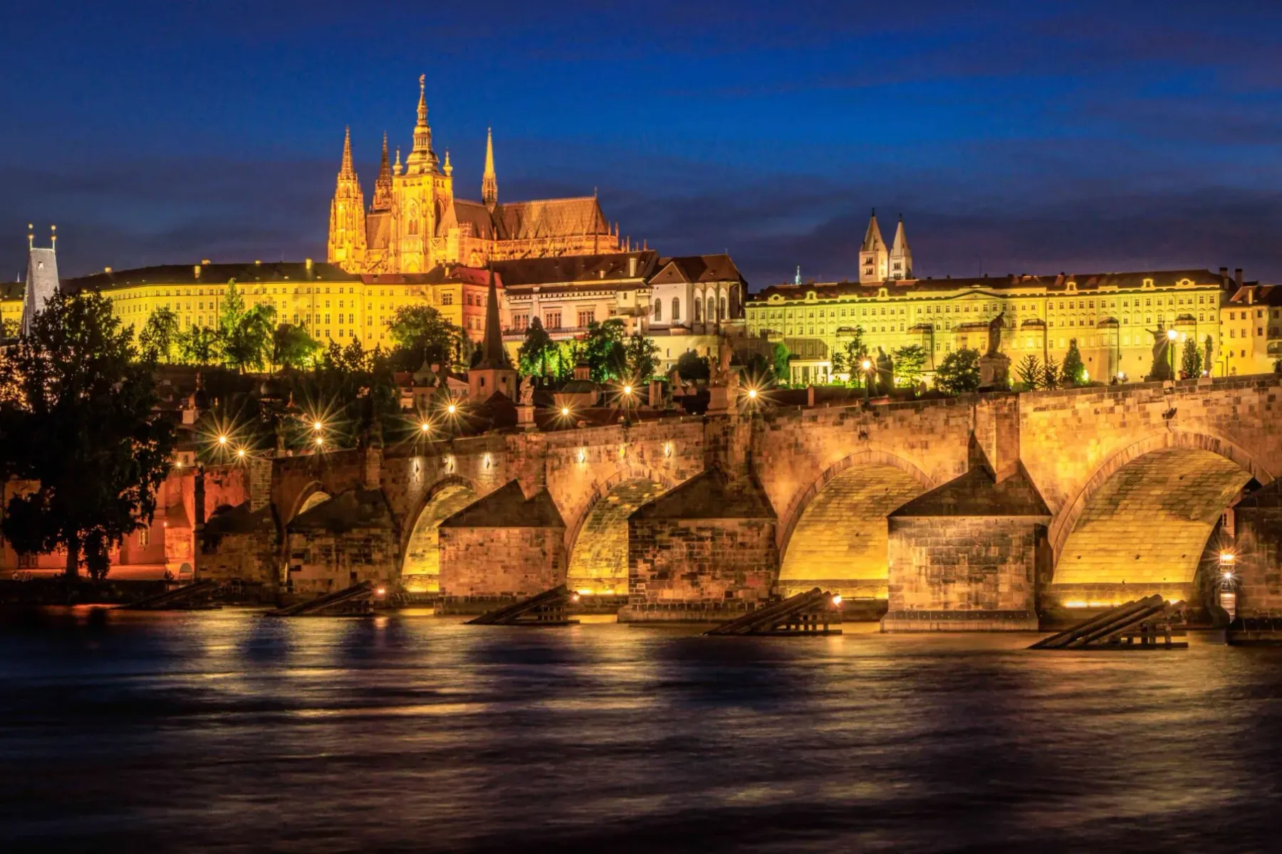Prague Castle and Charles Bridge at night.