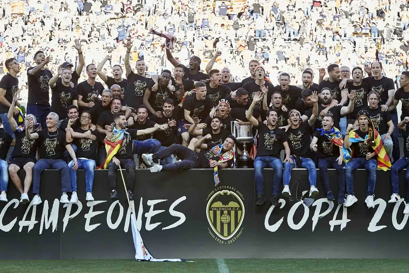 Valencia CF players celebrate winning the 2019 Copa del Rey in a stadium full of cheering fans.