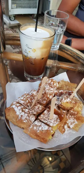 Enjoy a delicious Bougatsa and iced coffee in Athens, Greece.