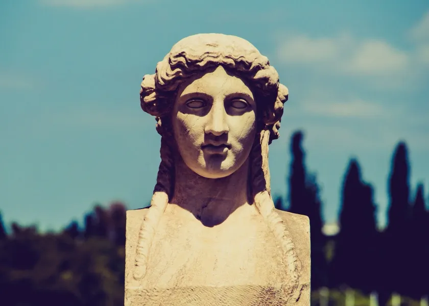 Close-up of an ancient Greek marble bust of a woman.