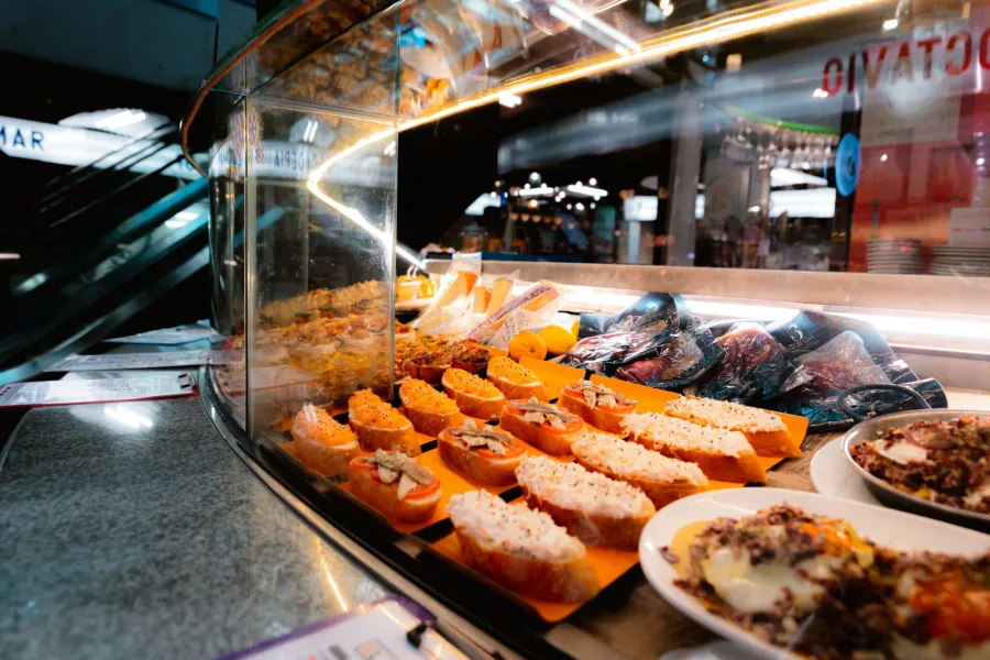 Delicious tapas displayed at a Madrid food stall.