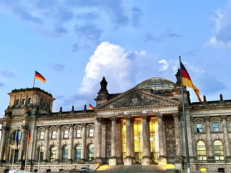 The Reichstag Building in Berlin, Germany, at dusk.