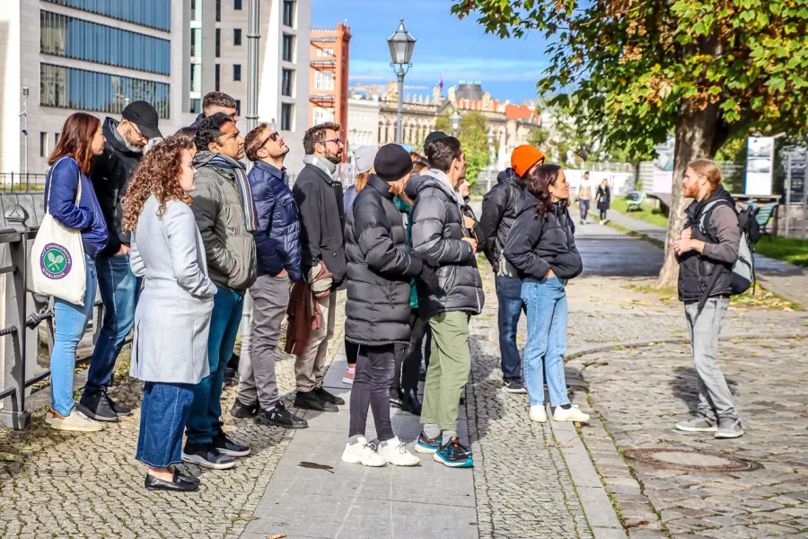 A group of tourists on a guided walking tour in Berlin, Germany.