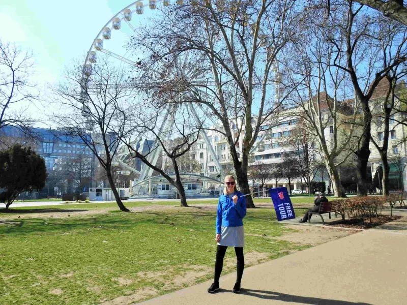 A Free Tour guide in Budapest stands near the Budapest Eye.