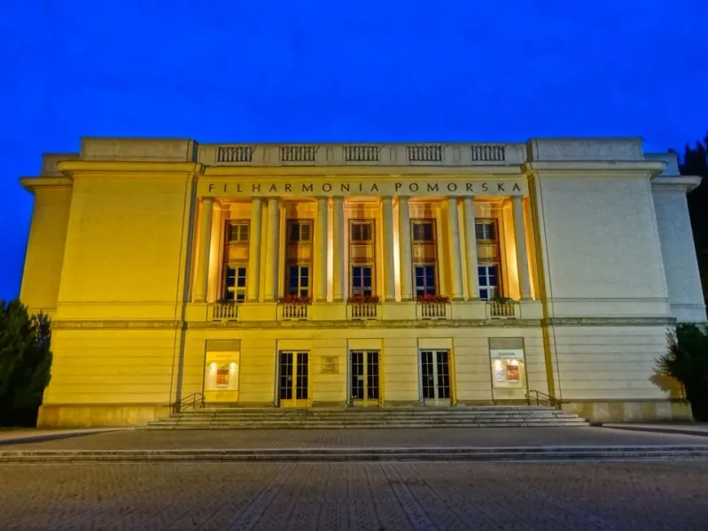 The grand Filharmonia Pomorska in Bydgoszcz, Poland, illuminated at night.