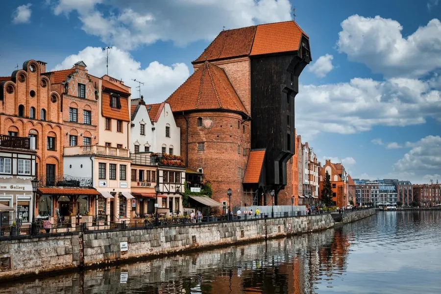 Explore Gdansk's historic waterfront, featuring the iconic Crane and colorful buildings.