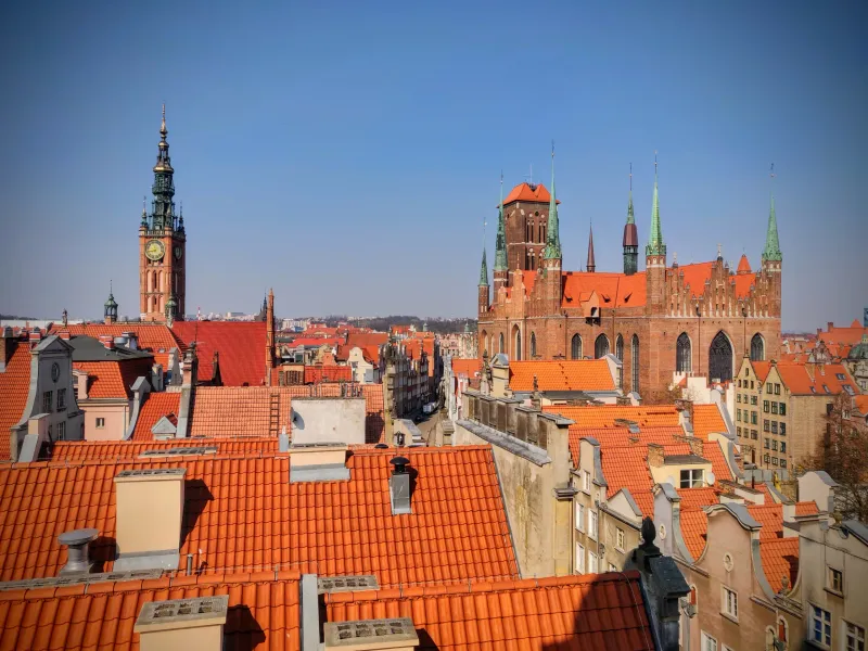 Panoramic view of Gdansk's Old Town, featuring St. Mary's Church and the Town Hall.