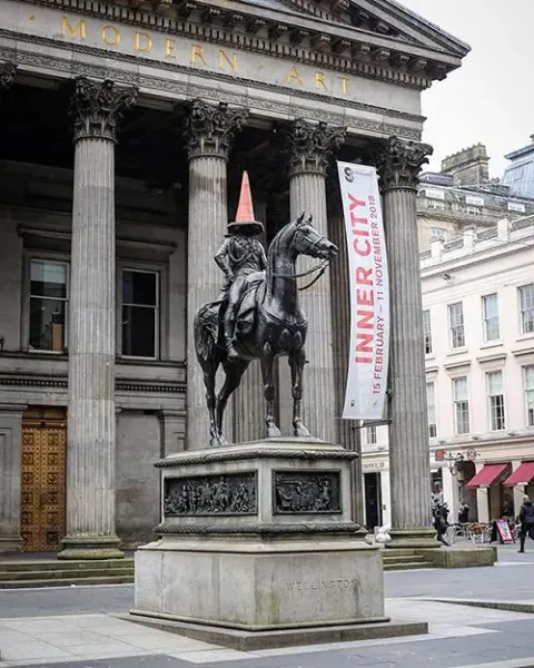 The Duke of Wellington statue in Glasgow, Scotland, wearing a traffic cone.