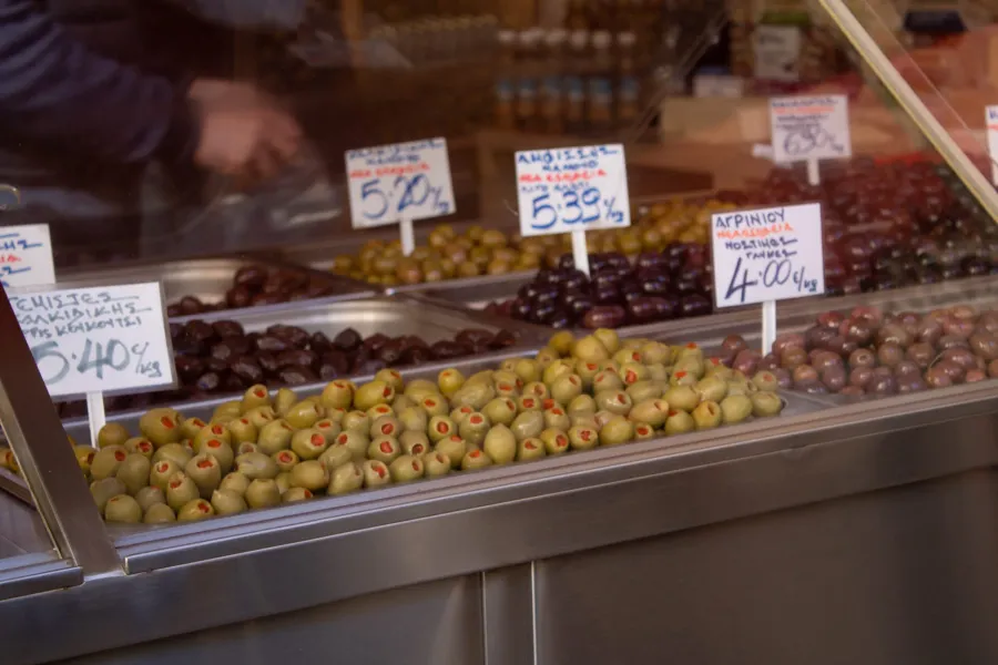 Assorted olives on display at a Greek market.
