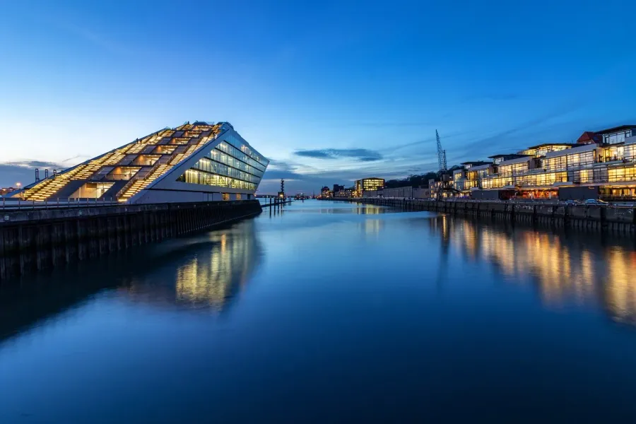 The Elbe Philharmonic Hall in Hamburg, Germany, at twilight, reflecting in the harbor.