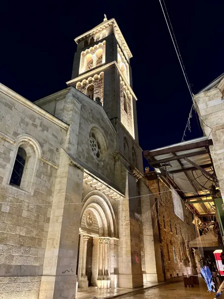 Illuminated Church of St. Anne at night in Jerusalem's Old City.