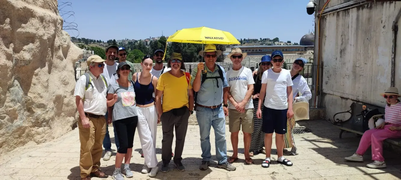 Happy tourists on a guided tour in Jerusalem.