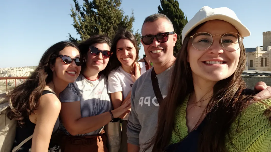 Happy tourists on a guided tour in Jerusalem's Old City.