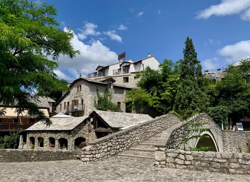 Stone bridge leading to a hotel in Kotor's Old Town, Montenegro.