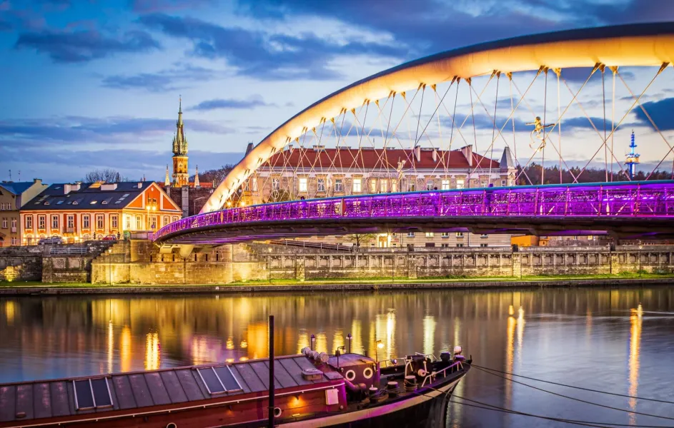 Father Bernatek Footbridge in Krakow at night.