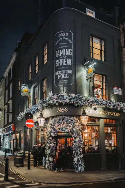 Mr. Fogg's Tavern in London at night, beautifully decorated.