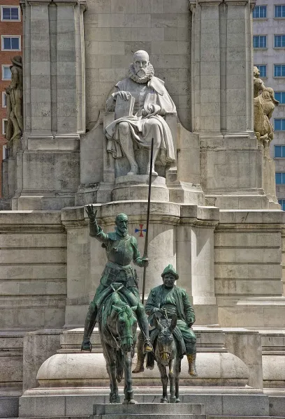 The magnificent Cervantes Monument in Madrid, featuring statues of Cervantes, Don Quixote, and Sancho Panza.