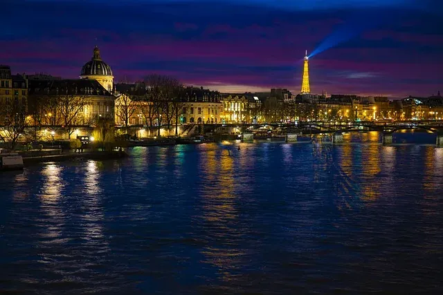 Paris at night: Eiffel Tower and Seine River.