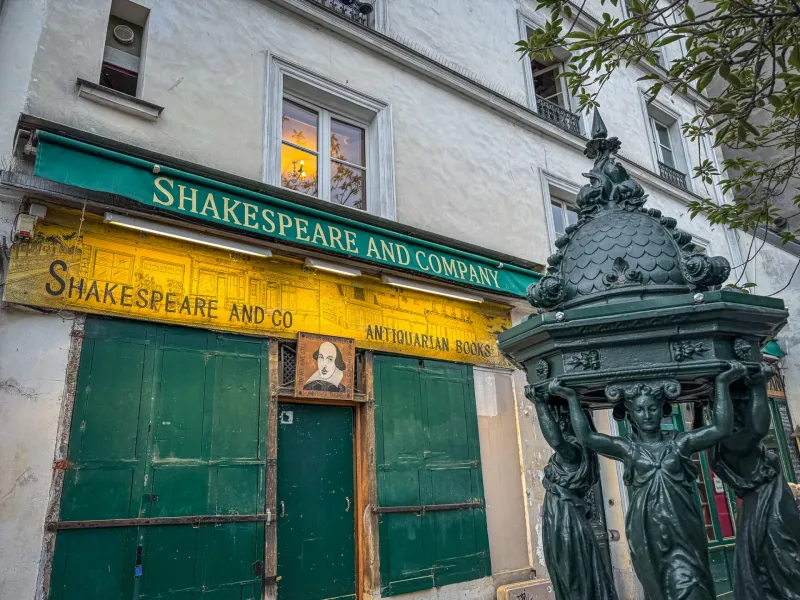 Shakespeare and Company bookstore in Paris, with a charming antique fountain.