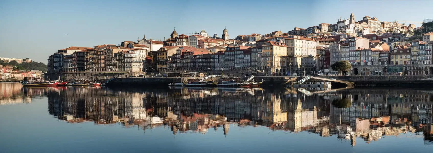 Stunning reflection of Porto's Ribeira district in the Douro River.