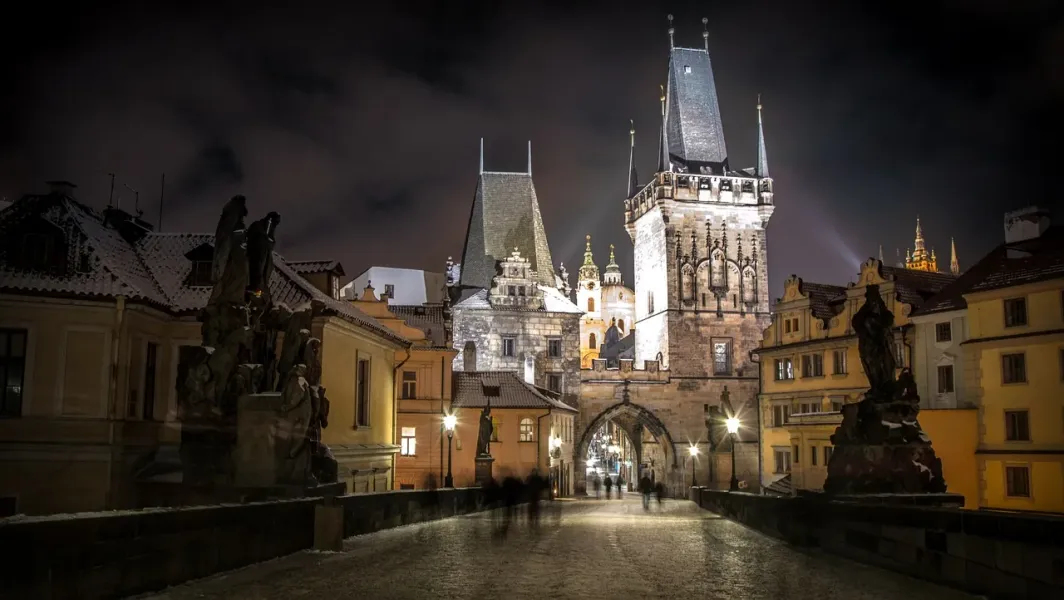 Night view of Prague's Old Town Bridge Tower during a Ghost & Legends Tour.