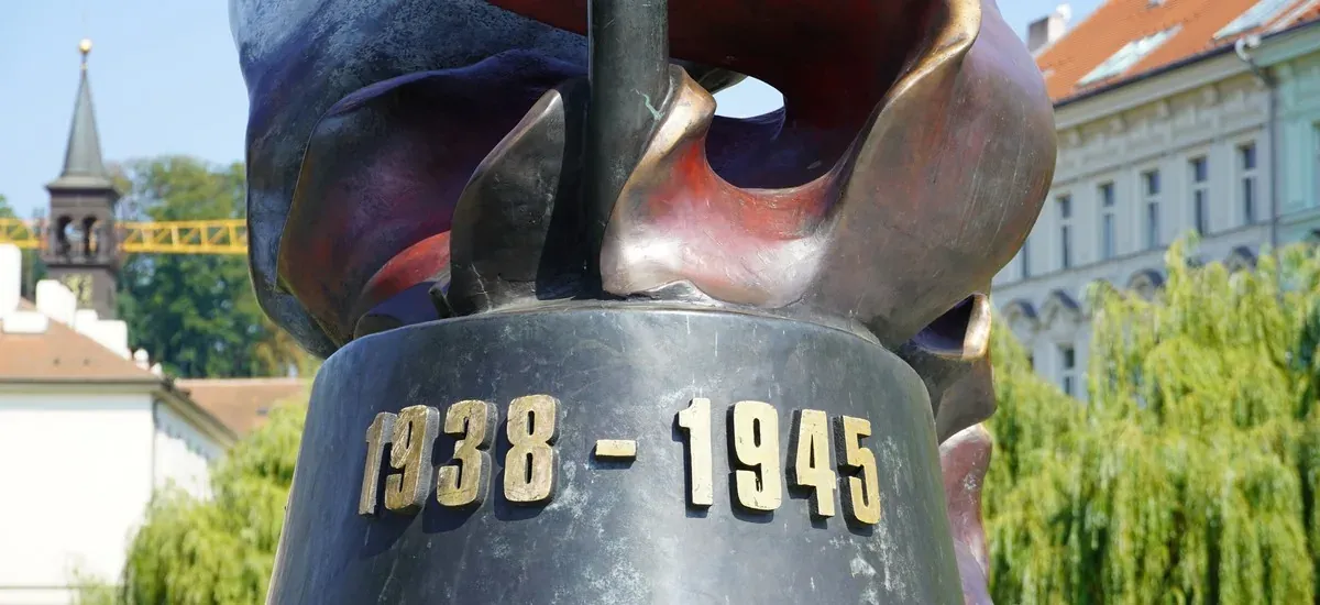Close-up of a bronze sculpture in Prague, commemorating 1938-1945.